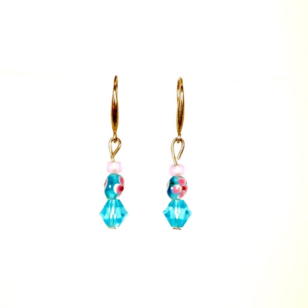 Aquamarine with red flower ornament